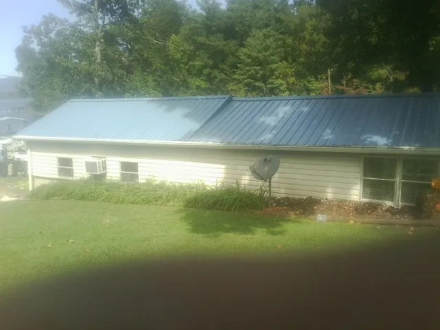 Blue metal roof running the length of a single story home in Fort Ransom